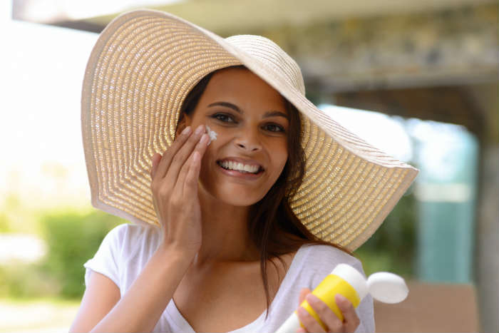 Woman Applying Sun Cream