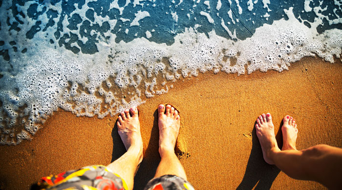 cliche holiday photos-feet in the sand